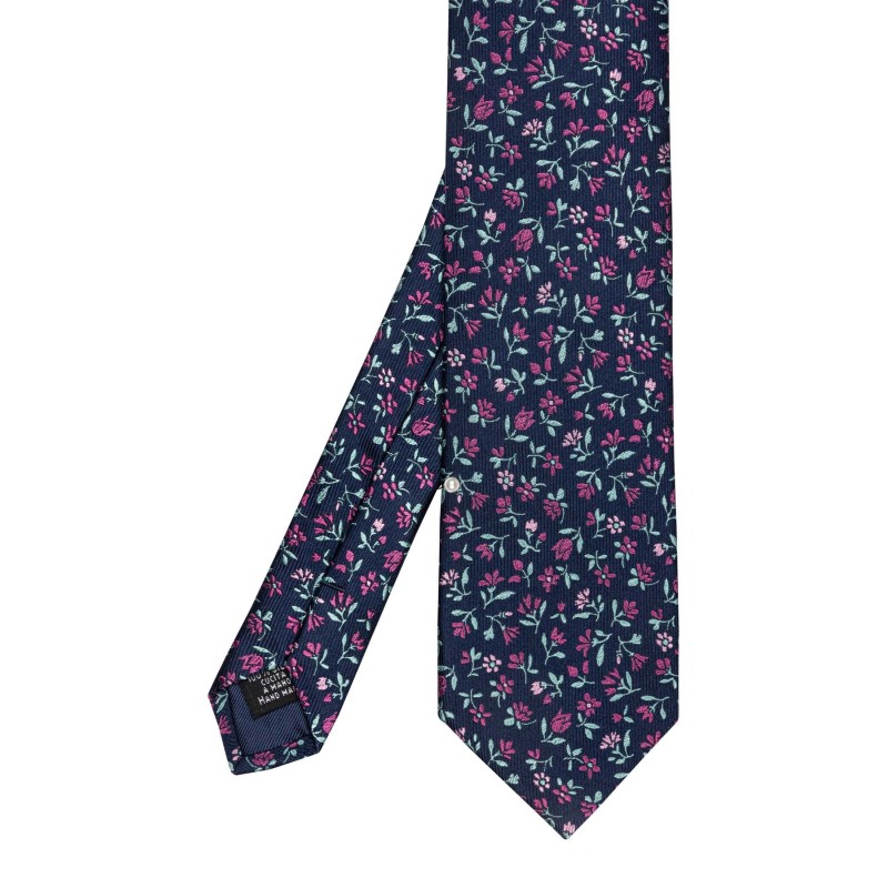 cravate en soie bleu marine à motifs fleuris rose vert et rose pale